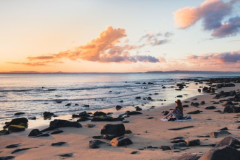 woman sitting seashore woman sitting seashore