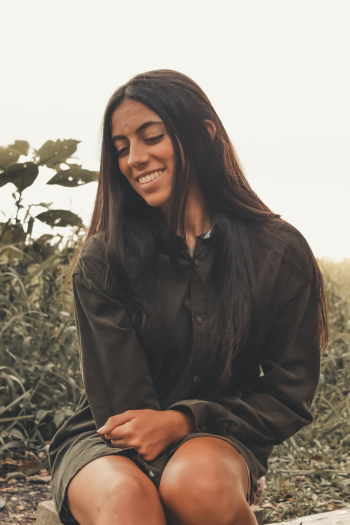 Woman Smiling Near Bushes Woman Smiling Near Bushes