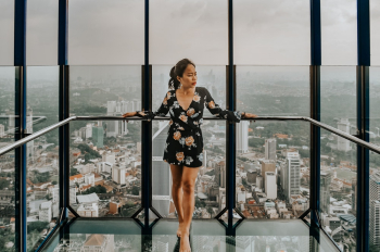 Woman Standing Against Railing Woman Standing Against Railing