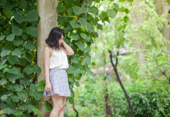 Woman Standing Against Tree Woman Standing Against Tree