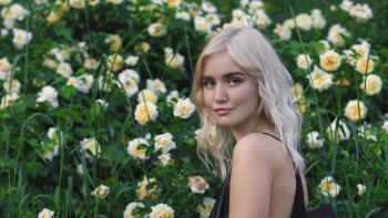 Woman Standing Beside Flower Garden Woman Standing Beside Flower Garden