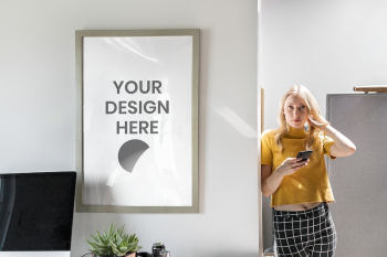 Woman standing by a picture | Free PSD Mockup - rawpixel