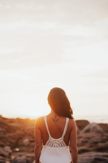 Woman Standing Facing Sunrise Woman Standing Facing Sunrise