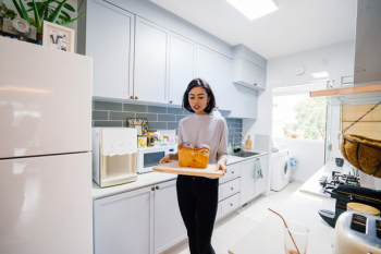 Woman Standing Holding Chopping Board Woman Standing Holding Chopping Board
