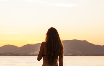 Woman Standing in Front of the Sea Woman Standing in Front of the Sea