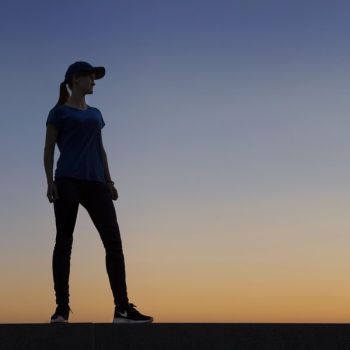 Woman Standing Infront Of Perfect Sunset Woman Standing Infront Of Perfect Sunset