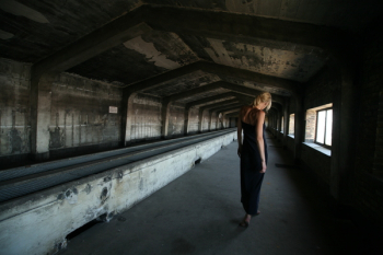 Woman Standing Inside Attic Woman Standing Inside Attic