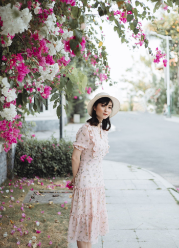 Woman Standing Near Bougainvillea