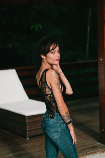 Woman Standing Near Lounge Chair Woman Standing Near Lounge Chair