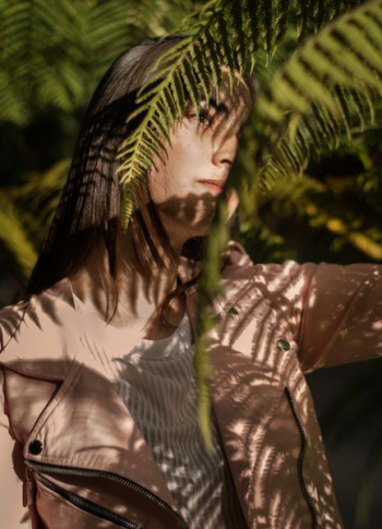 woman standing near plant at daytime