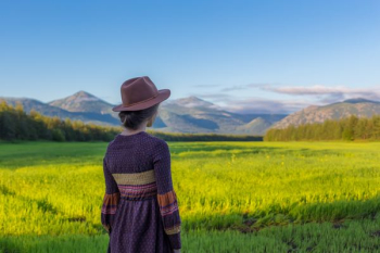 woman standing near rice field woman standing near rice field