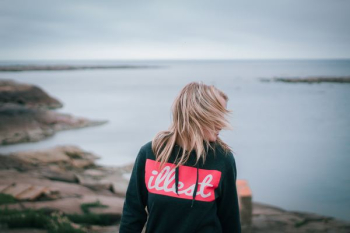 woman standing near sea woman standing near sea