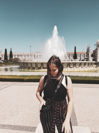Woman standing near water fountain