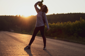Woman Standing on Asphalt Road Woman Standing on Asphalt Road