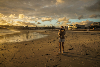 Woman Standing On Beach Shore Woman Standing On Beach Shore