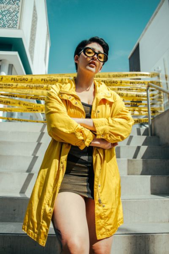 woman standing on concrete stairs