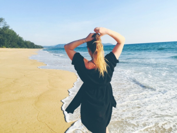 Woman Standing on Sea Shore Woman Standing on Sea Shore