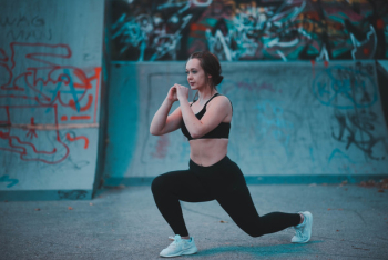 Woman Stretching Beside Wall Woman Stretching Beside Wall