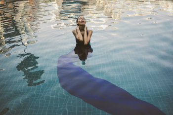 Woman Swimming on Pool Woman Swimming on Pool