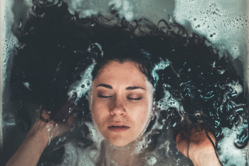 Woman Taking Bath Inside Bathtub Woman Taking Bath Inside Bathtub