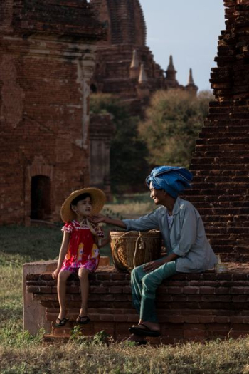 woman touching girl's face woman touching girl's face