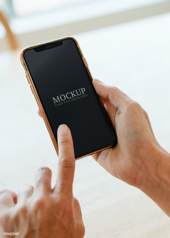 Woman using a mobile phone mockup during coronavirus quarantine | Free  psd mockup - 2311539