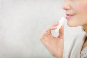 Woman Using Lip Balm Woman Using Lip Balm