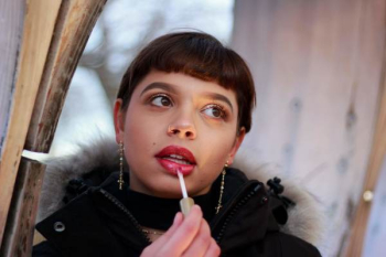 Woman Using Red Lipstick Woman Using Red Lipstick