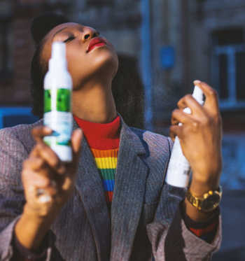 Woman Using White Spray Bottle Woman Using White Spray Bottle