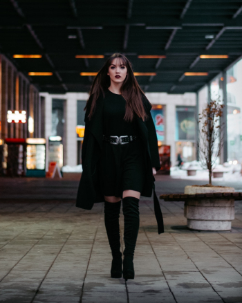 Woman Walking Alone on Pathway
