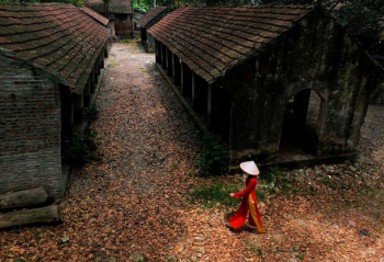 woman walking near abandoned houses woman walking near abandoned houses