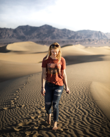 Woman Walking on Sand Dunes Woman Walking on Sand Dunes