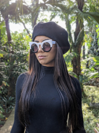 Woman Wearing a Cap and Sunglasses Woman Wearing a Cap and Sunglasses