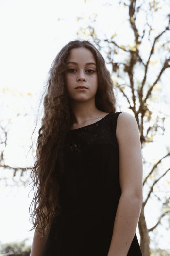 Woman Wearing Black Boat-neck Sleeveless Dress Woman Wearing Black Boat-neck Sleeveless Dress