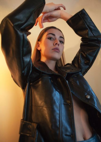 woman wearing black leather jacket woman wearing black leather jacket