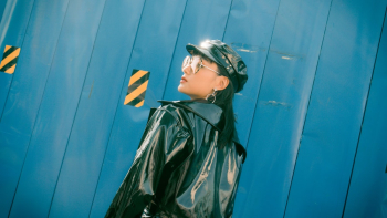 Woman Wearing Black Patent Leather Jacket
