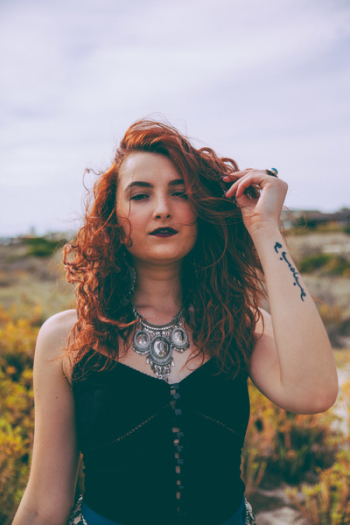 Woman Wearing Black Sleeveless Top Woman Wearing Black Sleeveless Top
