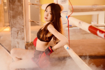 Woman Wearing Black Sports Bra and Short on Boxing Ring Woman Wearing Black Sports Bra and Short on Boxing Ring