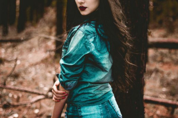 woman wearing blue chambray dress woman wearing blue chambray dress