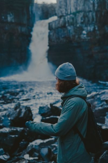 woman wearing coat near falls