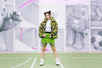 Woman Wearing Coat With Green Mini Skirt Woman Wearing Coat With Green Mini Skirt