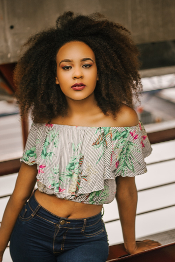 Woman Wearing Crop Top And Denim Bottoms Woman Wearing Crop Top And Denim Bottoms
