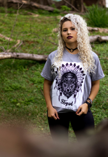 Woman Wearing Gray and Black Tribal Graphic Crew-neck Shirt and Black Pants