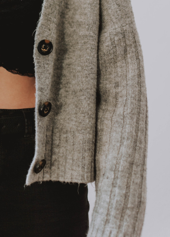 Woman Wearing Gray Button-up Wool Sweater Woman Wearing Gray Button-up Wool Sweater