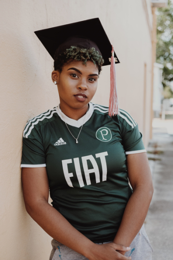 Woman Wearing Green And White Adidas Jersey T-Shirt Woman Wearing Green And White Adidas Jersey T-Shirt