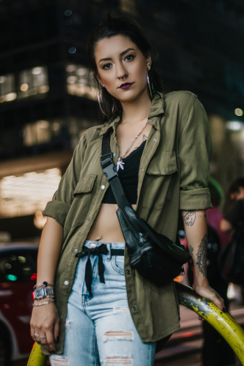 Woman Wearing Green Coat and Black Fanny Bag Woman Wearing Green Coat and Black Fanny Bag
