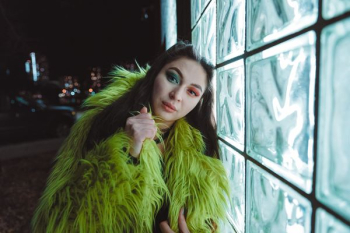 woman wearing green fur top