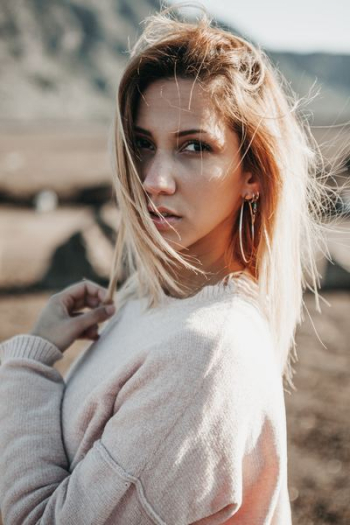 woman wearing long-sleeved shirt woman wearing long-sleeved shirt