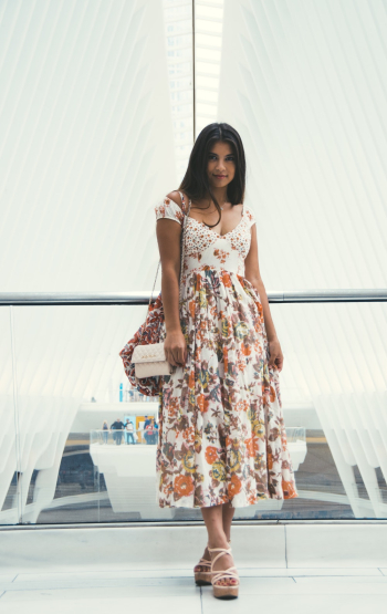 Woman Wearing Orange and White Floral V-neck Cap-sleeved Maxi Dress Woman Wearing Orange and White Floral V-neck Cap-sleeved Maxi Dress