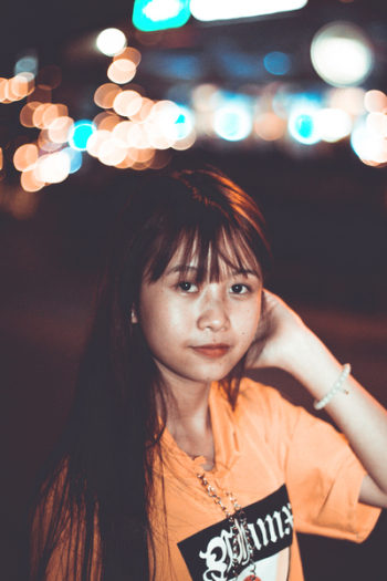 Woman Wearing Orange Crew-neck Top Woman Wearing Orange Crew-neck Top
